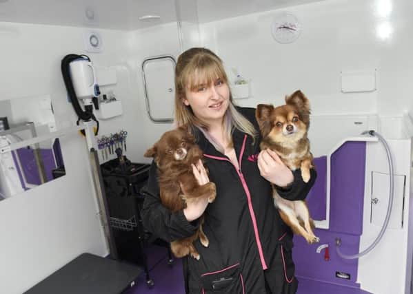 Louise Cameron who has opened a dog grooming salon in her back garden called Pawfectly Pampered.  She is pictured with dogs Chico and Tootsie Pic: Greg Macvean