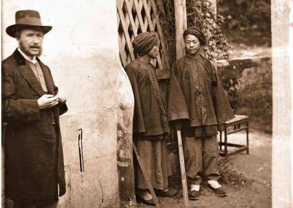 Edinburgh-born photographic pioneer John Thomson, left, poses for a rare self-portrait with two Manchu soldiers in Xiamen, on the southern 
frontier of the Qing empire. Pictures: The Wellcome Library