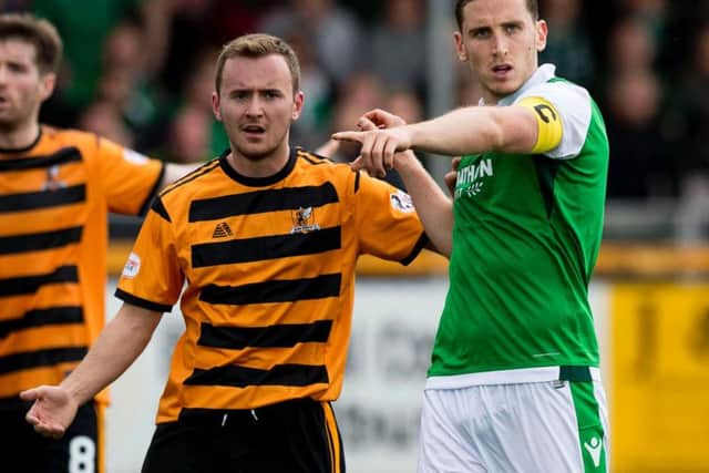 Paul Hanlon will likely start at the back for Hibs