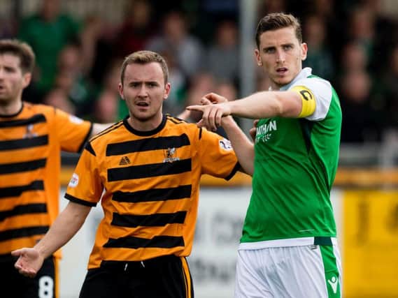 Paul Hanlon will likely start at the back for Hibs