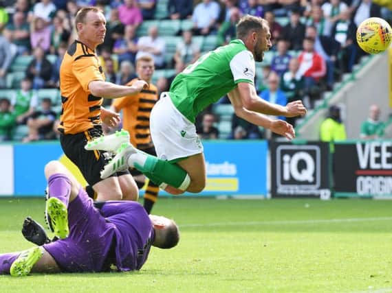 Neil Parry was injured trying to stop Christopher Doidge from opening the scoring for Hibs.