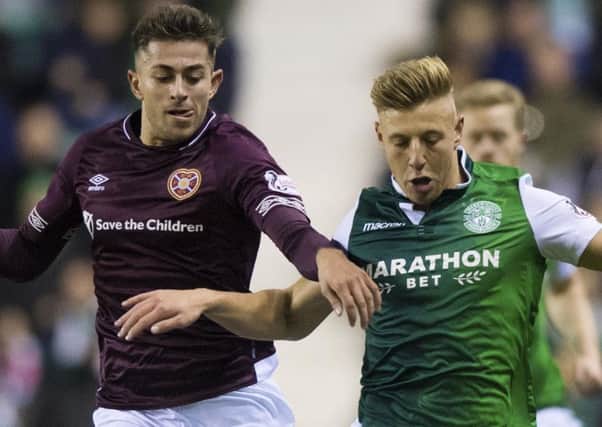 Marcus Godinho, left, in action with Hibernian's Sean Mackie