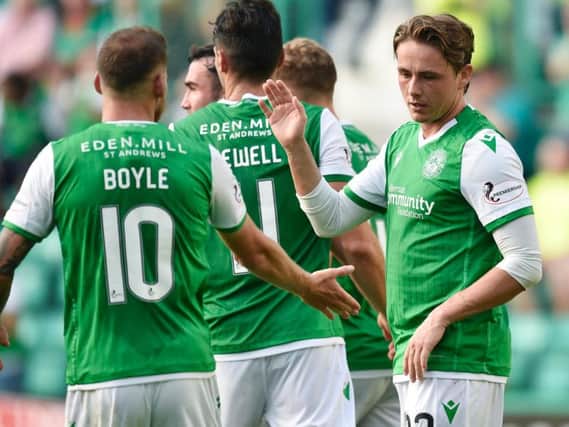 Scott Allan is congratulated by his team-mates after putting Hibs 2-0 ahead. Pic: SNS