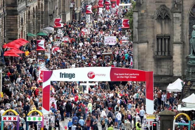 Festival-goers pack the High Street. Picture: PA