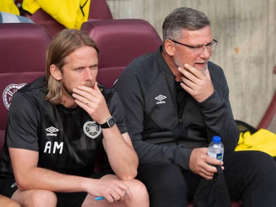 Craig Levein (right) and assistant Austin MacPhee take in the action at Tynecastle