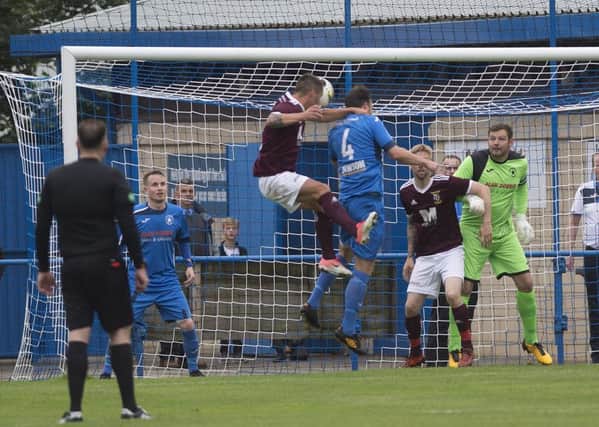 Ian Black opens the scoring for Tranent against Newtongrange with this header. Pic: TSPL