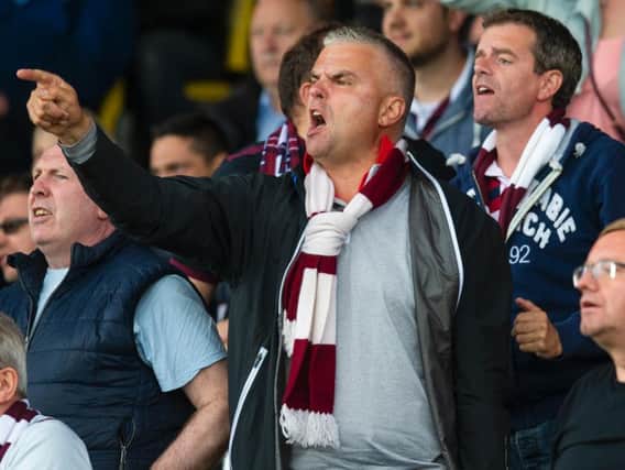 One fan shows his displeasure at he Hearts performance. Picture: SNS