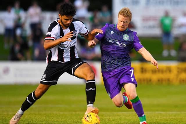 Hibs' Daryl Horgan challenges Rabin Omar of Elgin City during their Betfred Cup clash. Pic: SNS