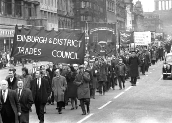 Workers march along Princes Street during the miners strike in January 1972