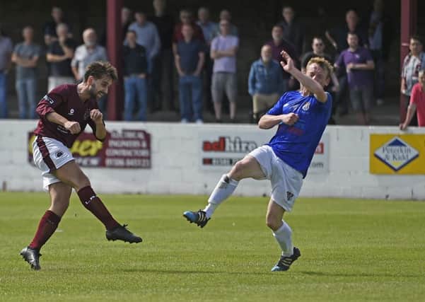 Danny Smith fires the ball home for Linlithgow Rose's opener. Pic: TSPL