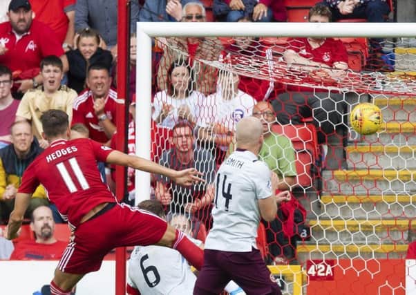 Substitute Ryan Hedges lashes home the winner with five minutes remaining to play at Pittodrie