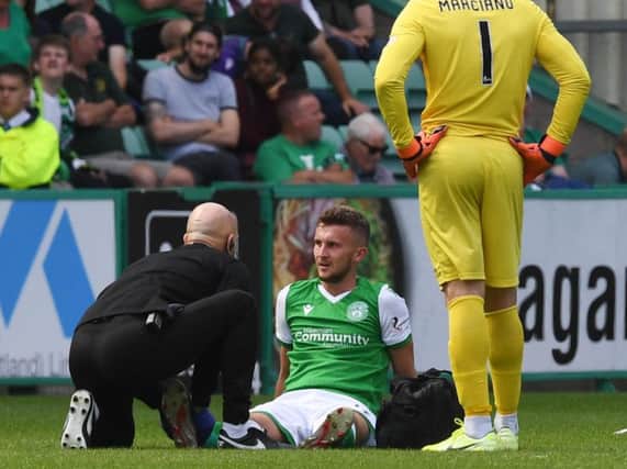 Tom James was injured by a challenge on him during the first half. Pic: SNS