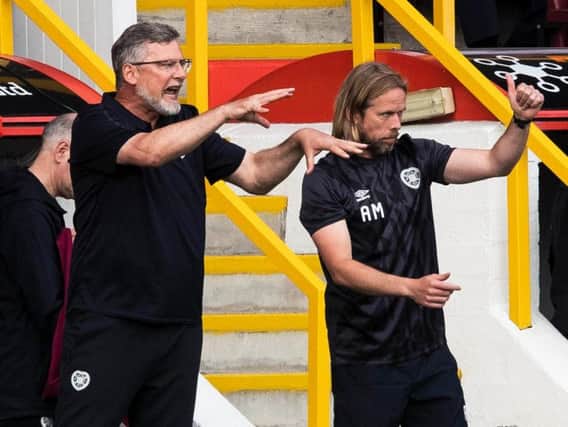 Craig Levein, left, tries to get his message across at Pittodrie.