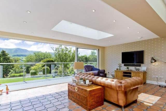 Nestled on a quiet residential street, this extended 1930s detached villa stretches across two levels and boasts five double bedrooms, three reception rooms, a large garden and a six-car driveway. Price: 1,200,000 GBP