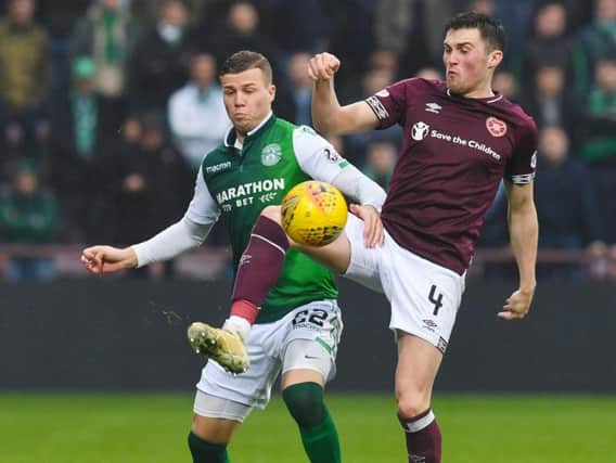 Hibs' Florian Kamberi and Hearts' John Souttar have admirers south of the border. Pic: SNS