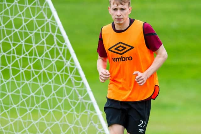 Hearts winger Lewis Moore has joined Falkirk on loan