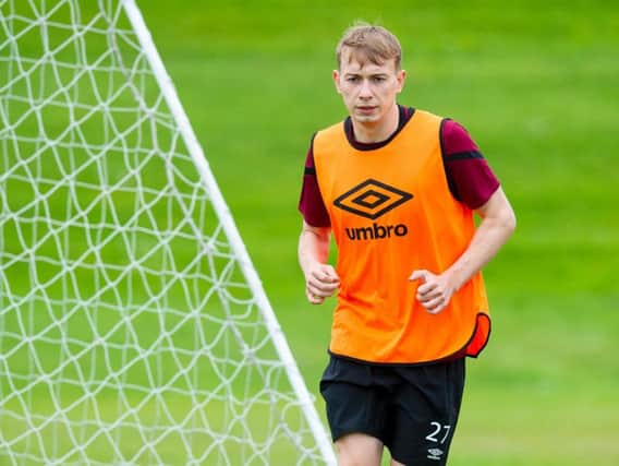 Hearts winger Lewis Moore has joined Falkirk on loan