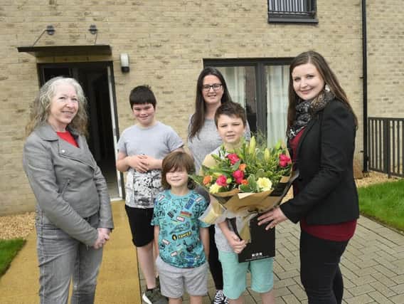 Cllr Kate Campbell and Cllr Mandy Watt with Laura Christison and her boys at their new affordable home, Picture: Edinburgh Council / Greg Macvean
