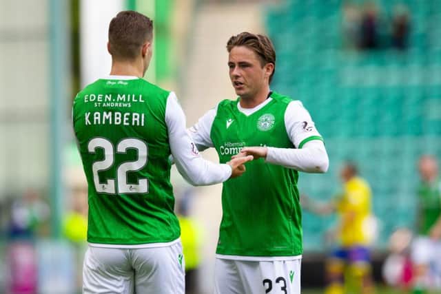 Flo Kamberi celebrates with Scott Allan after the Swiss striker made it 3-2 to Hibs. Pic: SNS