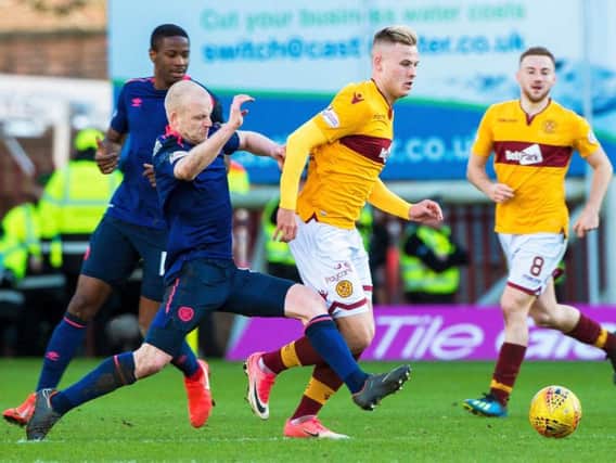 Steven Naismith tussles with James Scott in a meeting between the two sides at Fir Park last season