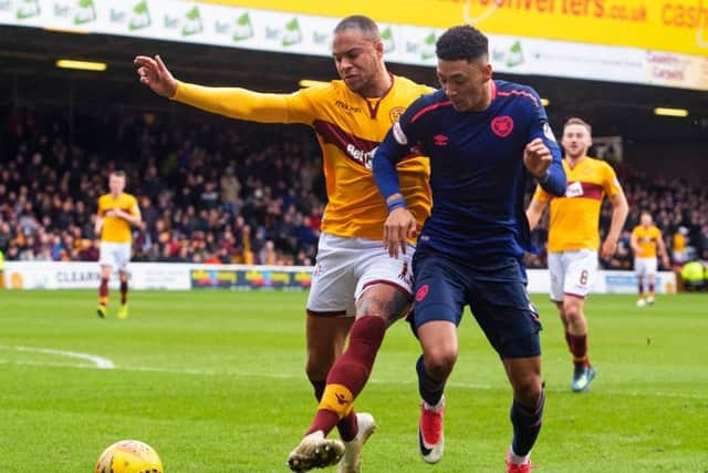 Charles Dunne and Sean Clare battle for possession the last time Hearts faced Motherwell at Fir Park.