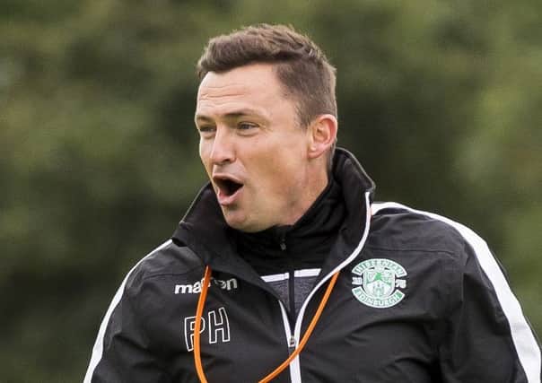 Hibs manager Paul Heckingbottom takes a training session