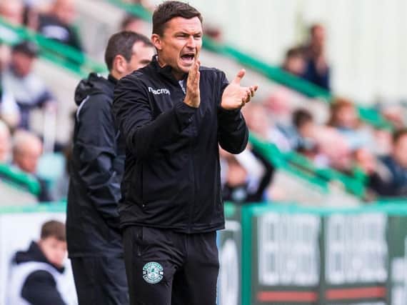 Paul Heckingbottom tries to get his instructions over to his Hibs team.
