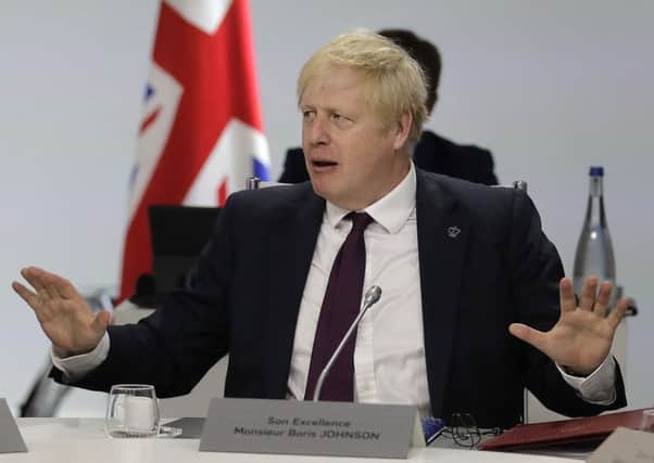 Boris Johnson gestures at the G7 summit. Picture: AP