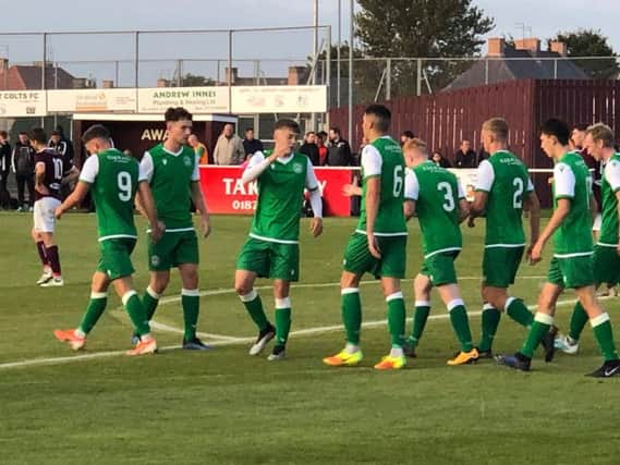 The Hibs players celebrate Jamie Gullans second goal