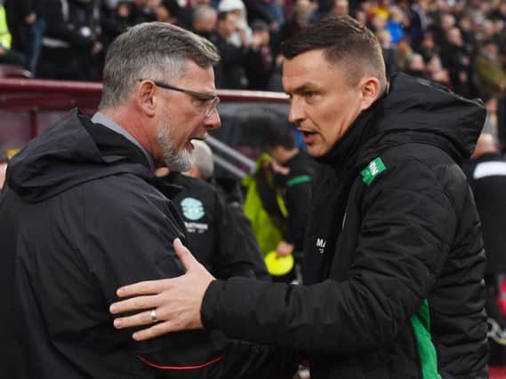 Hearts and Hibs fans want their managers to sign a striker. Picture: SNS
