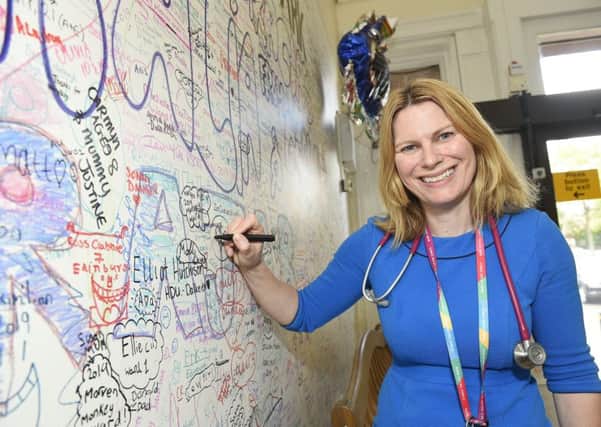 Mairi Stark, a member of the Royal College of Paediatrics and Child Health and lead for general paediatrics, pictures by the wall of farewell messages. Pic: Greg Macvean.