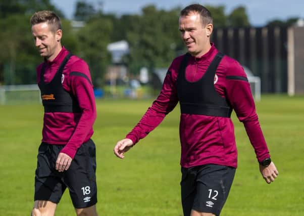 Glenn Whelan, right, is likely to feature for Hearts against Celtic. Pic: SNS