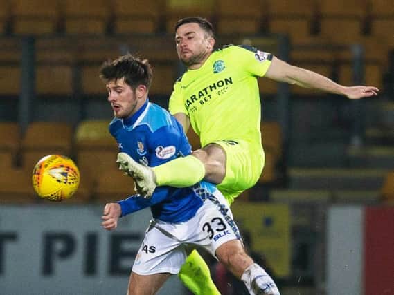 Lewis Stevenson battles Matty Kennedy for possession during February's clash last season. Picture: SNS