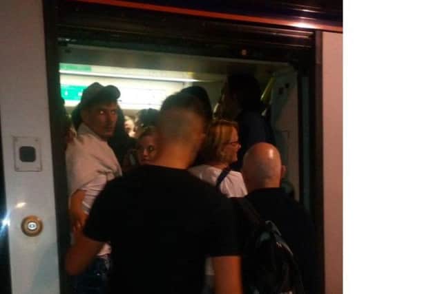 Passengers boarding a crowded train at Waverley station tonight. Picture: Dani Garavelli