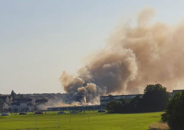 Smoke from the fire at Woodmill High School can be seen across Dunfermline. Picture: Andrew Boyle