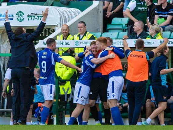 Tommy Wright celebrates in front of the Hibs support. Picture: SNS
