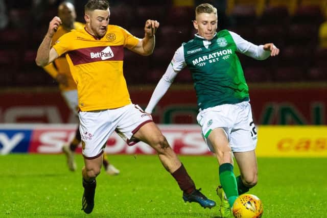 Oli Shaw battles for possession with Motherwell's Allan Campbell during Hibs' last trip to Fir Park in January.