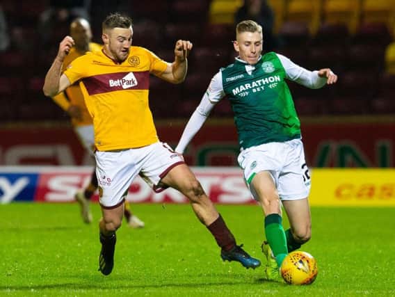 Oli Shaw battles for possession with Motherwell's Allan Campbell during Hibs' last trip to Fir Park in January.