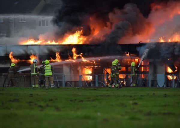 Emergency services battle the fire at  at Woodmill High School in Dunfermline. Picture: @Euans_EP/PA Wire