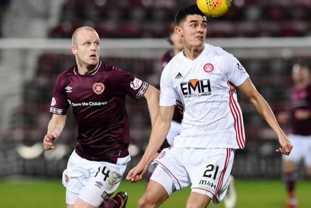 Steven Naismith battles for possession with Hamilton's Shaun Want during Hearts' 2-0 win last Boxing Day.