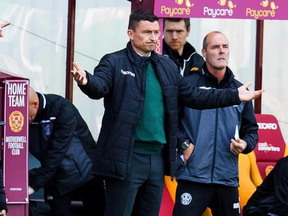 Hibs boss Paul Heckingbottom was a subdued figure on the touchline as the Easter Road men went down 3-0 at Motherwell. Picture: SNS