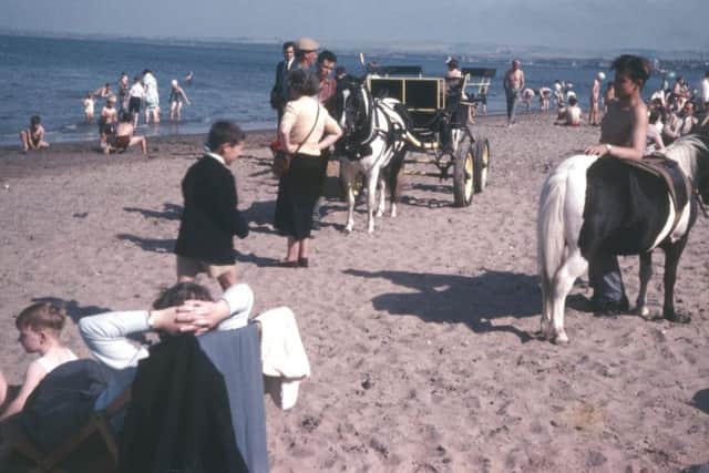 Families crowded the beaches to soak up the sun and enjoy pony rides on the sand