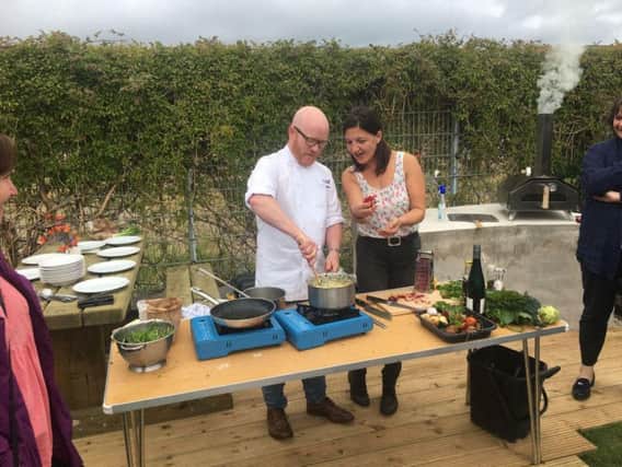 Cooking with gas: Scotlands national chef Gary MacLean and Julia Pennycuik of Muirhead community garden. Picture: Contributed