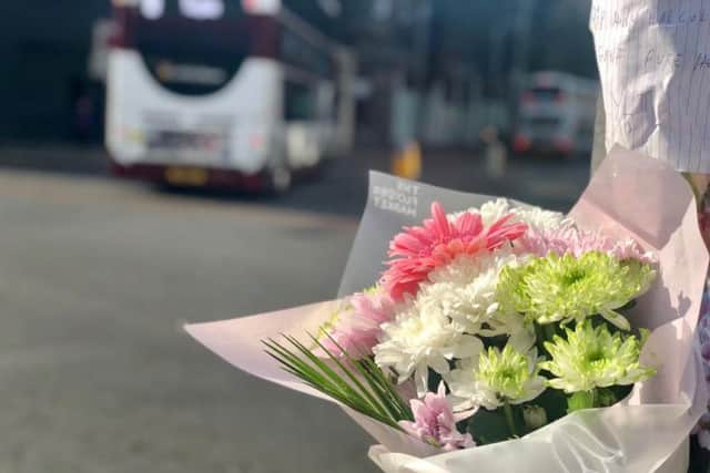 Floral tributes and messages laid at foot of Leith Walk after 62-year-old tragically died