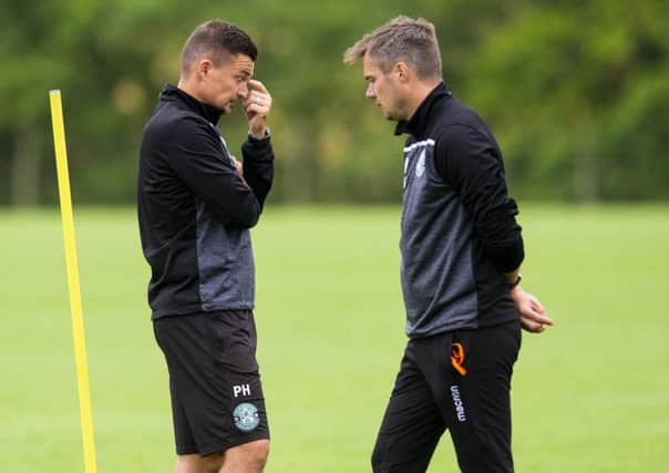 Hibs boss Paul Heckingbottom and his assistant Robbie Stockdale will be working hard on the training ground over the international break. Pic: SNS