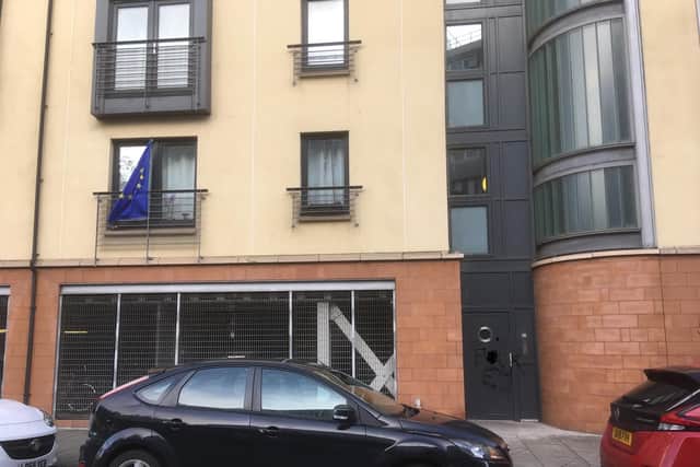 The EU flag hangs from a pole outside a flat window in Cables Wynd. Pic: Anne Balfour.