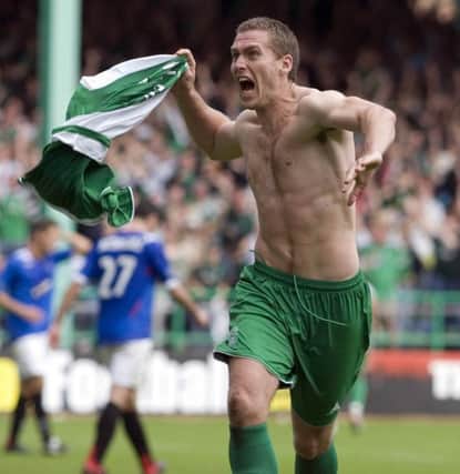 Chris Killen celebrates his second goal and collects a yellow card for taking off his shirt