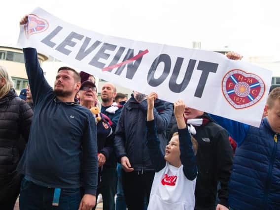 Hearts fans make their feelings known. Picture: SNS