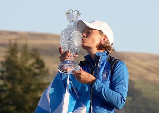 Catriona Matthew with the Saltire and a kiss for the Solheim Cup