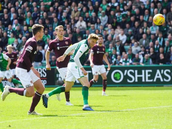 Hibs midfielder Vykintas Slivka evades the Hearts defence for an effort on goal during the last Edinburgh derby